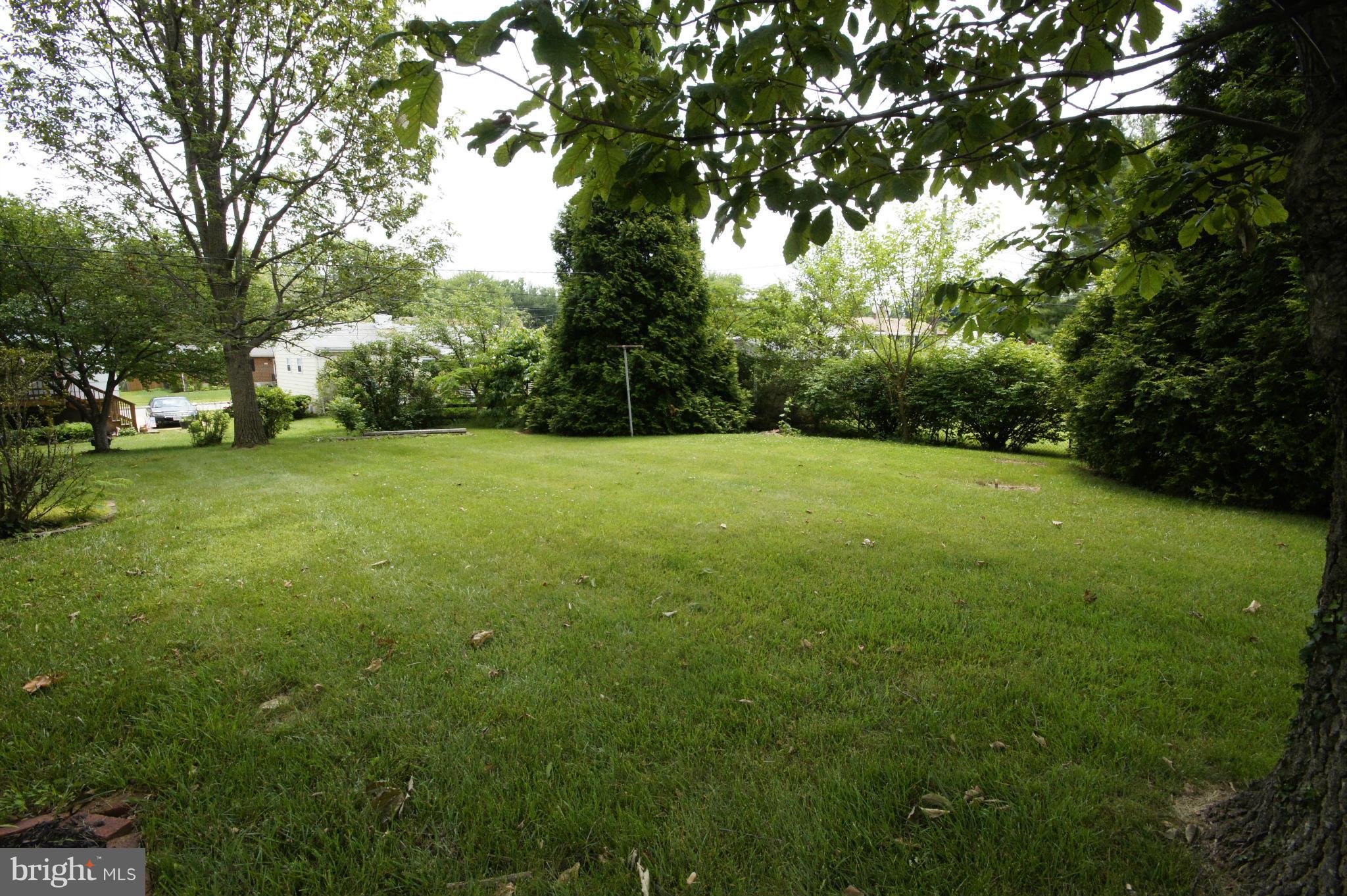 6202 Gilston Park Road Baltimore, MD 21228 - Photo 19 of 21 a view of a field of grass and trees