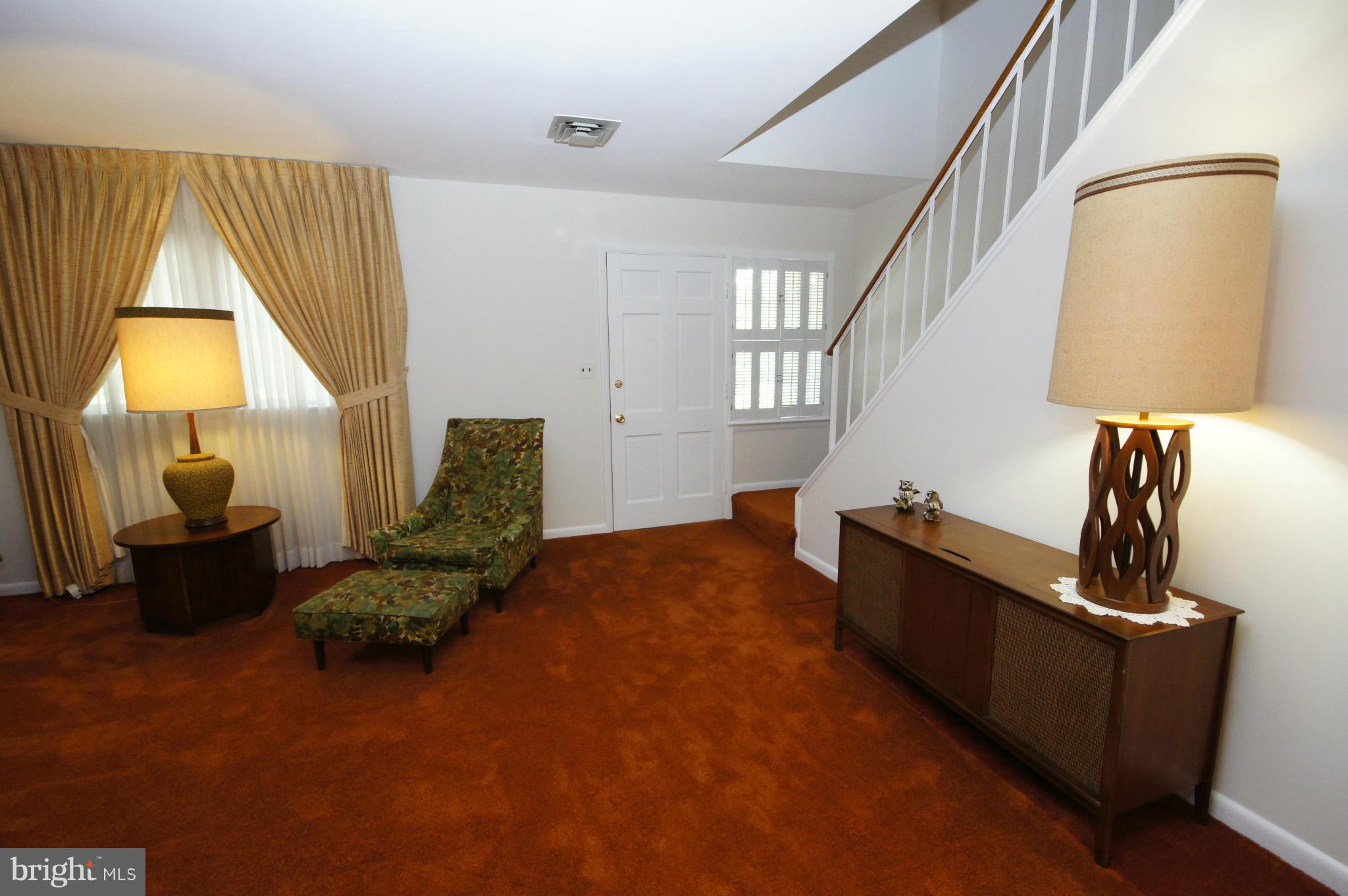6202 Gilston Park Road Baltimore, MD 21228 - Photo 3 of 21 a living room with furniture and a window