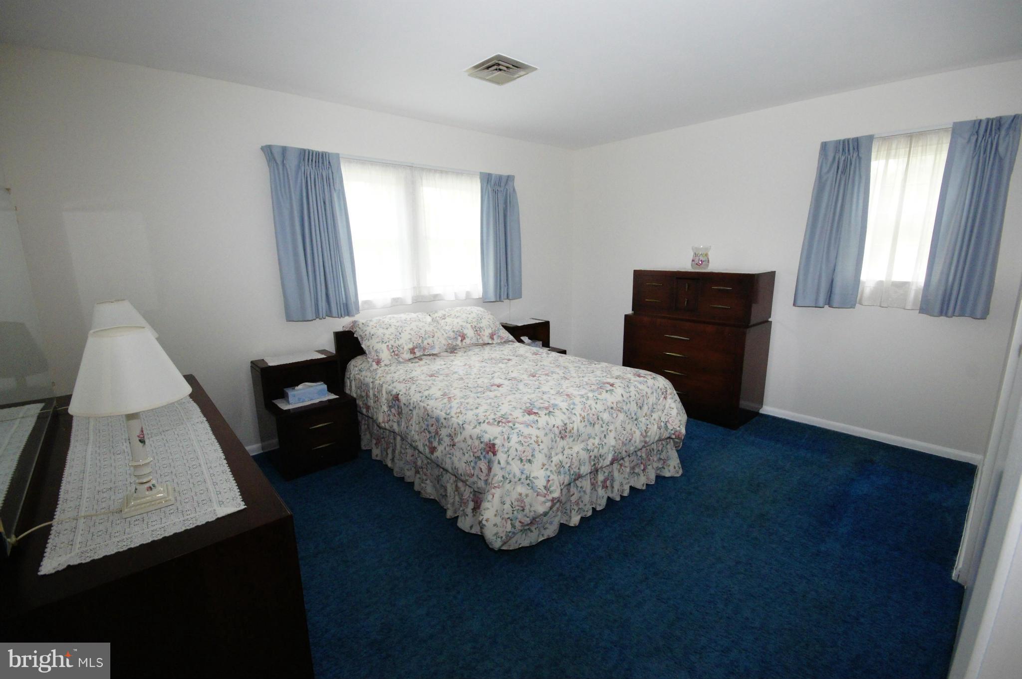 6202 Gilston Park Road Baltimore, MD 21228 - Photo 6 of 21 a bedroom with a bed and a window