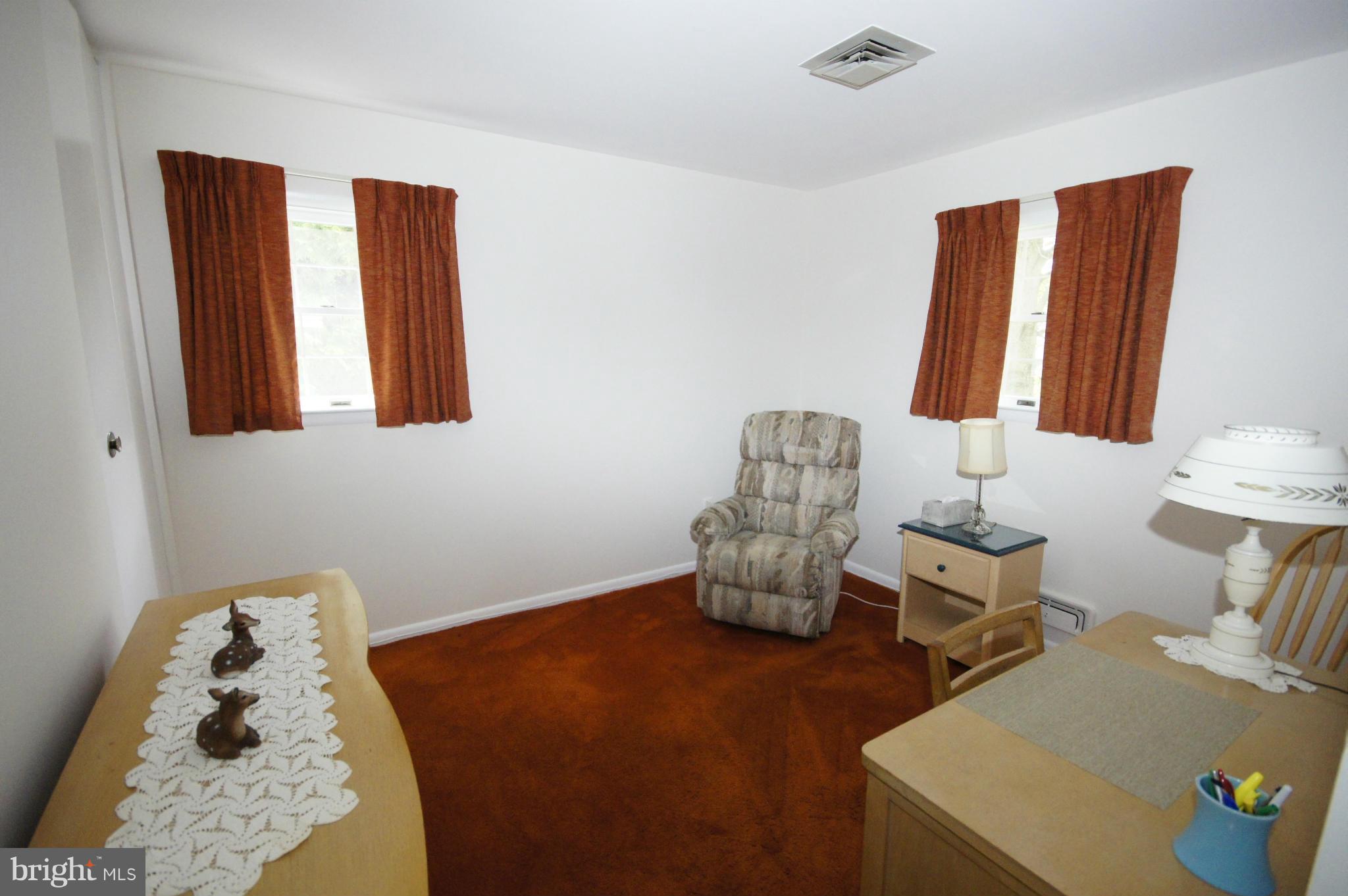 6202 Gilston Park Road Baltimore, MD 21228 - Photo 7 of 21 a bedroom with furniture and a bed