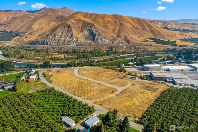 a view of a swimming pool with a table and chairs