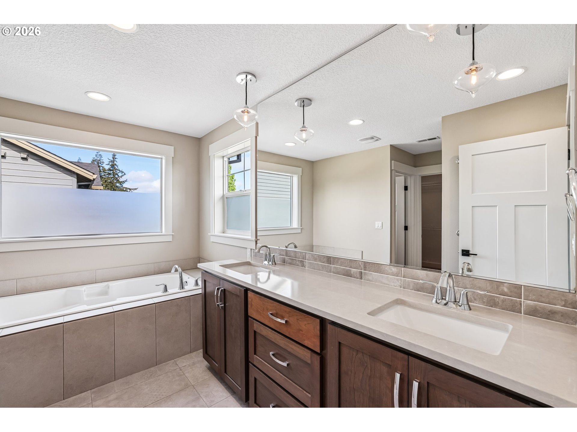 38320 Sequoia Street Sandy, OR 97055 - Photo 21 of 33 a bathroom with a sink double vanity granite tub and a mirror