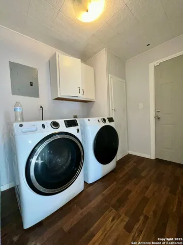 a utility room with sink dryer and washer