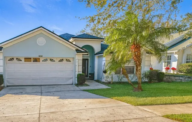 a view of a house with a yard