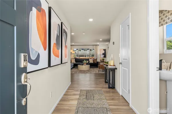 a view of living room with furniture and a fireplace