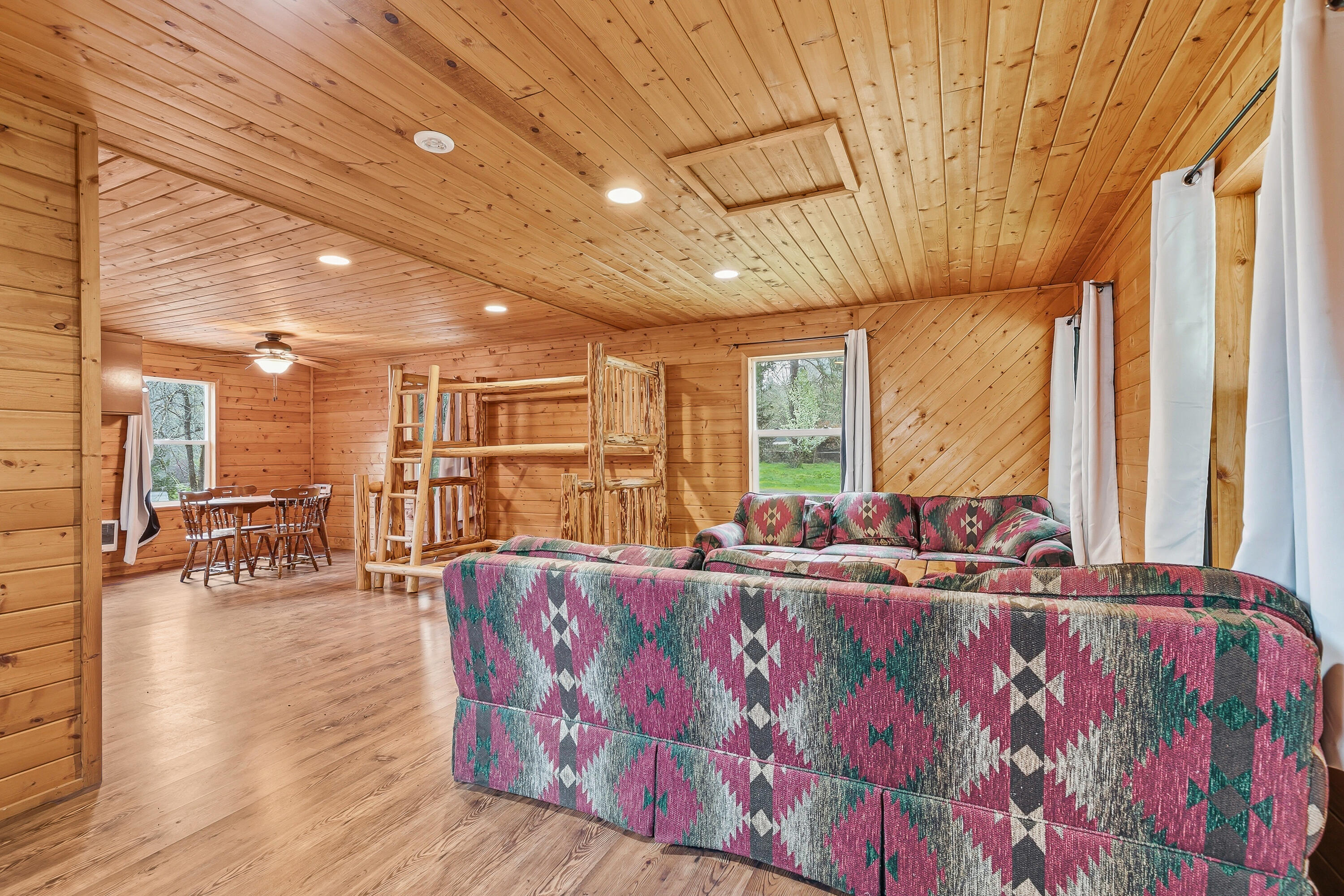 159 Bloom Road Wolf Creek, OR 97497 - Photo 7 of 38 a living room with furniture and a large window