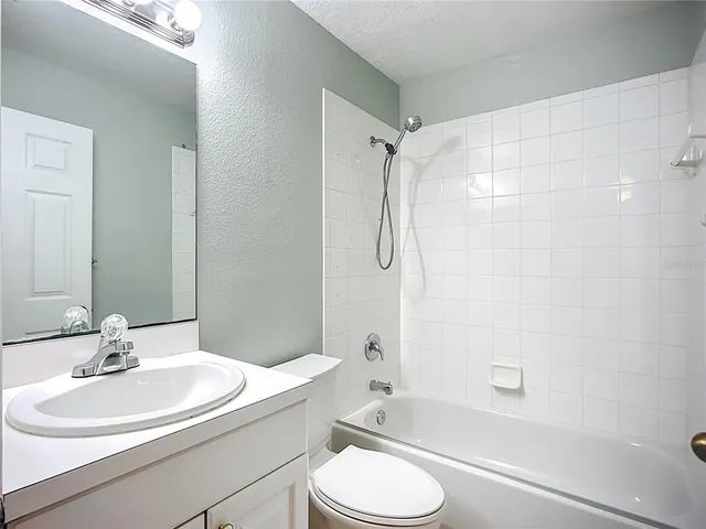 a view of a hallway to a bedroom and a bedroom