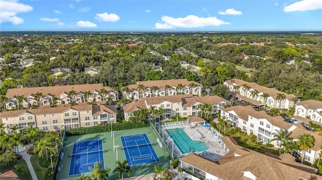 an aerial view of residential houses with outdoor space