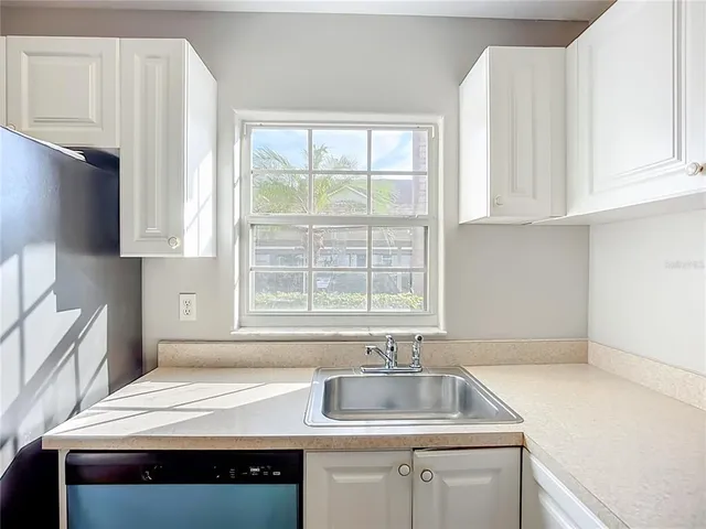 a bedroom with a bed and a cabinets
