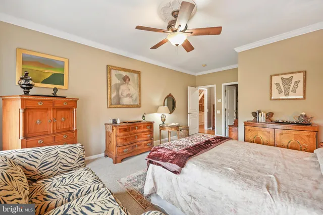 a bed room with a bed and a chandelier