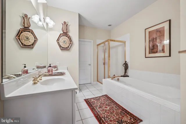 a bathroom with a sink a toilet and a bathtub