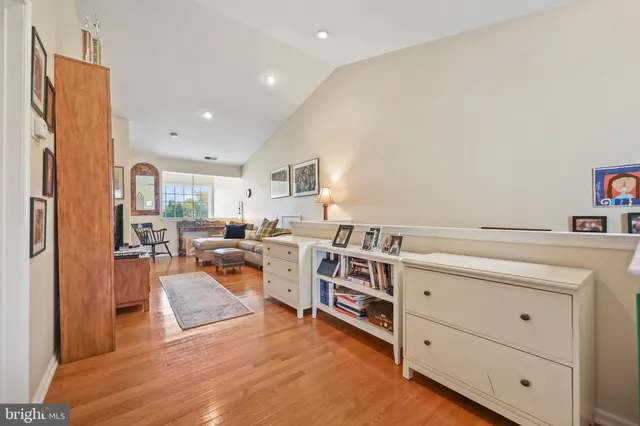 a bedroom with furniture and wooden floor