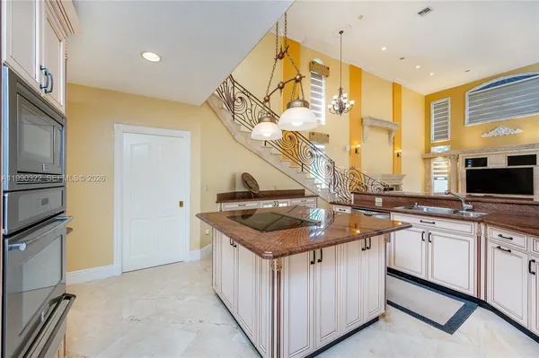 a view of a livingroom with a fireplace wooden floor and window