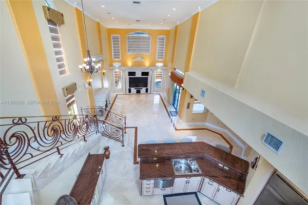 a spacious bathroom with a granite countertop tub and a large mirror