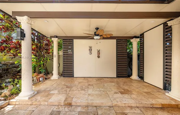 a view of a house with backyard porch and sitting area