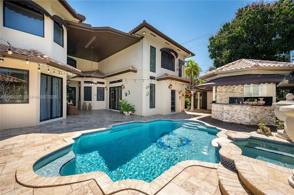 a kitchen with stainless steel appliances granite countertop a stove a sink and a granite counter tops