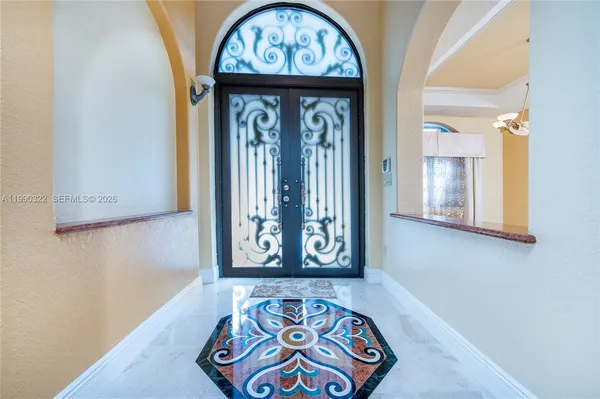 a kitchen with stainless steel appliances granite countertop a stove and a refrigerator