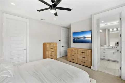 a bedroom with a bed and a cabinets