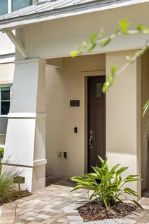 a bathroom with a granite countertop sink a mirror and a shower
