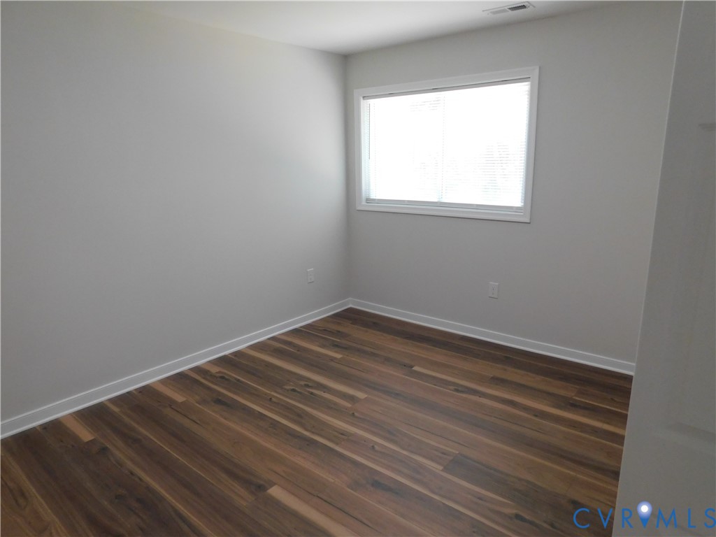 5322 Adams Road Quinton, VA 23141 - Photo 46 of 56 Wood-finish flooring with white trim, light gray w