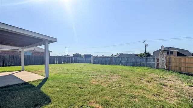a view of a backyard with a small cabin