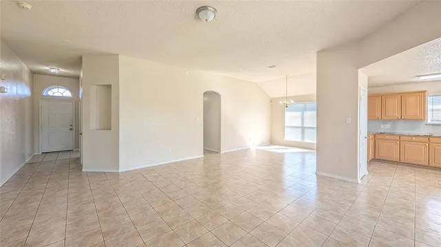 a view of a kitchen with a sink and a window