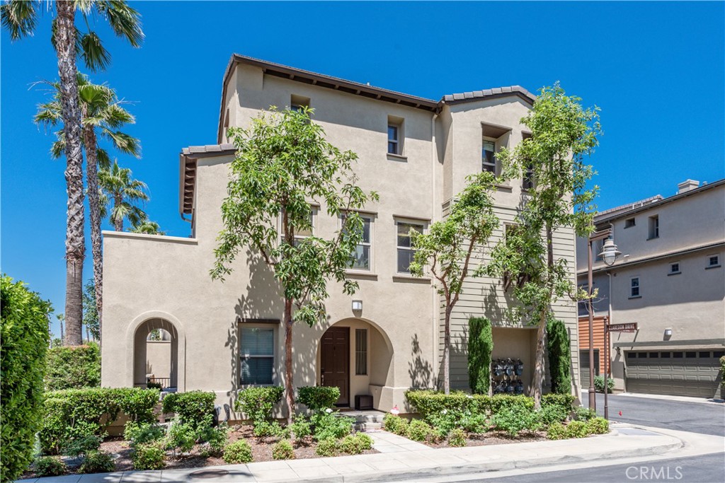 12371 Claredon Drive, Unit 6 Rancho Cucamonga, CA 91739 - Photo 1 of 1 a front view of a house with a garden