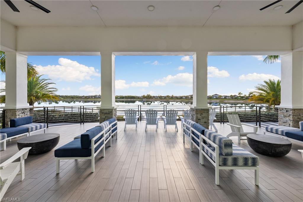 3967 Pegasus Way Naples, FL 34120 - Photo 43 of 50 a view of a balcony with chairs and wooden floor