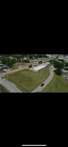 a view of a swimming pool with a yard
