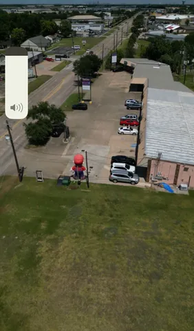 a view of a backyard with table and chairs