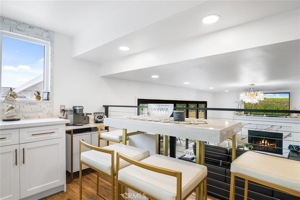 1216 Baseline Road La Verne, CA 91750 - Photo 13 of 37 a kitchen with a table chairs stove and cabinets