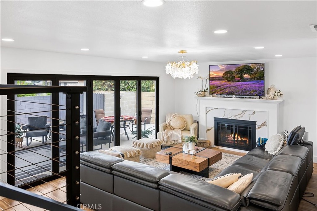1216 Baseline Road La Verne, CA 91750 - Photo 14 of 37 a living room with furniture and a fireplace
