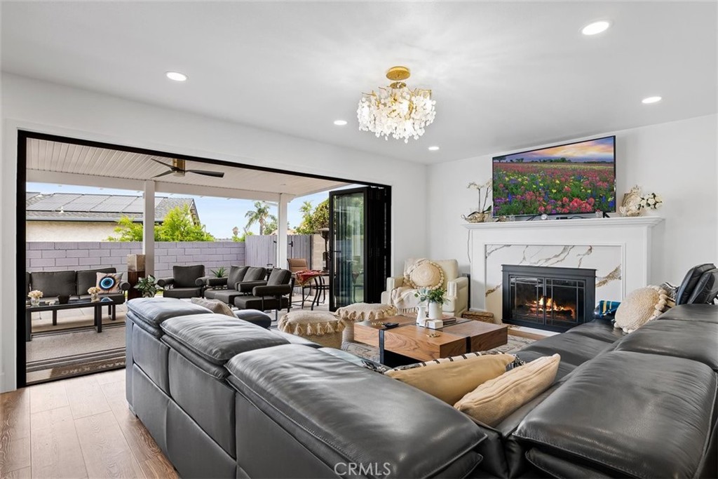 1216 Baseline Road La Verne, CA 91750 - Photo 15 of 37 a living room with fireplace furniture and a flat screen tv