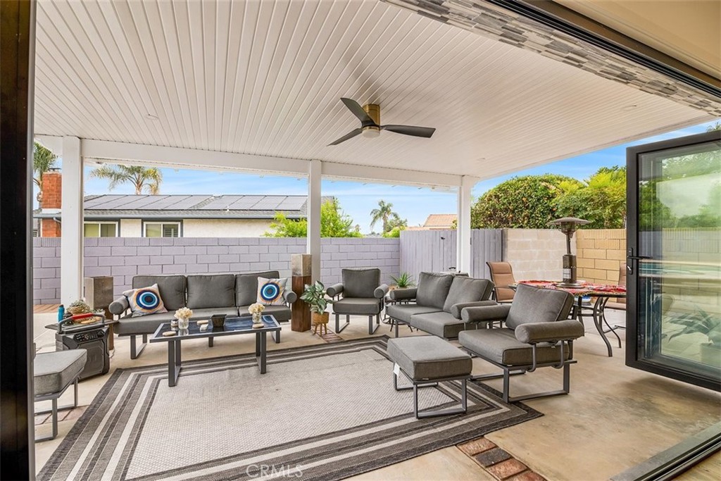 1216 Baseline Road La Verne, CA 91750 - Photo 16 of 37 a living room with patio furniture and a floor to ceiling window