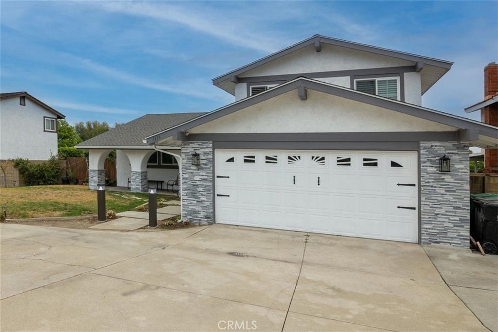 1216 Baseline Road La Verne, CA 91750 - Photo 2 of 37 a view of a house with a garage