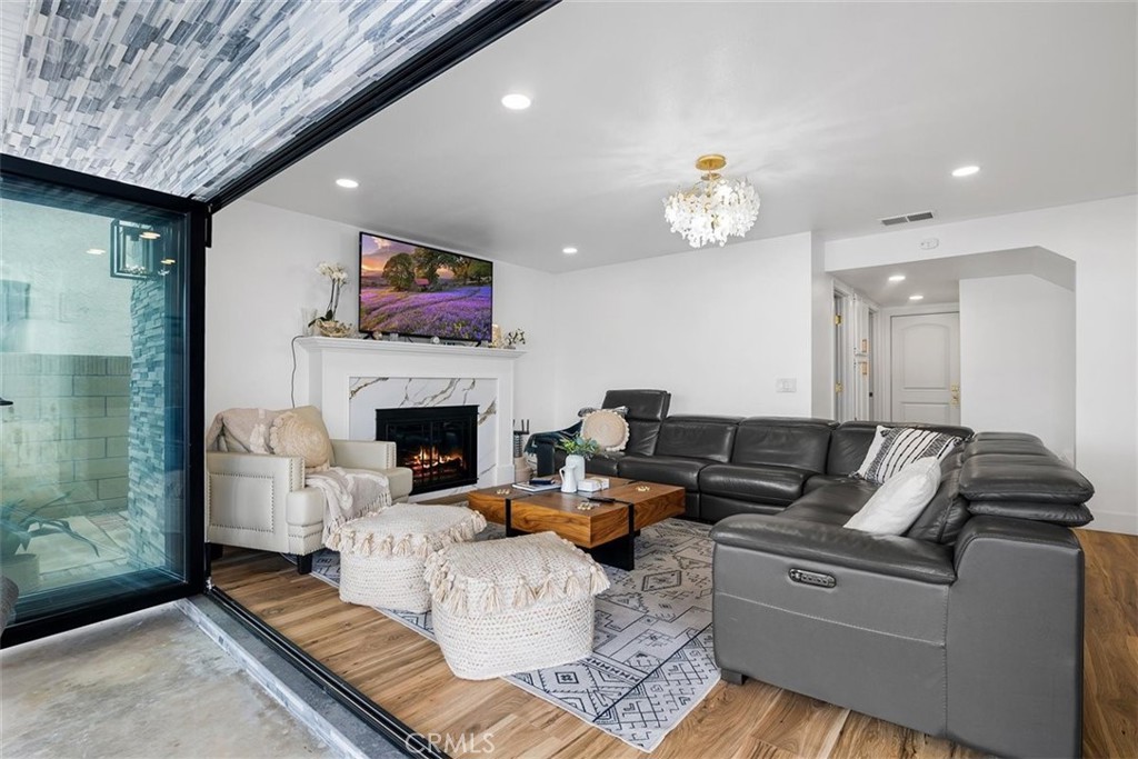 1216 Baseline Road La Verne, CA 91750 - Photo 21 of 37 a living room with furniture and a fireplace