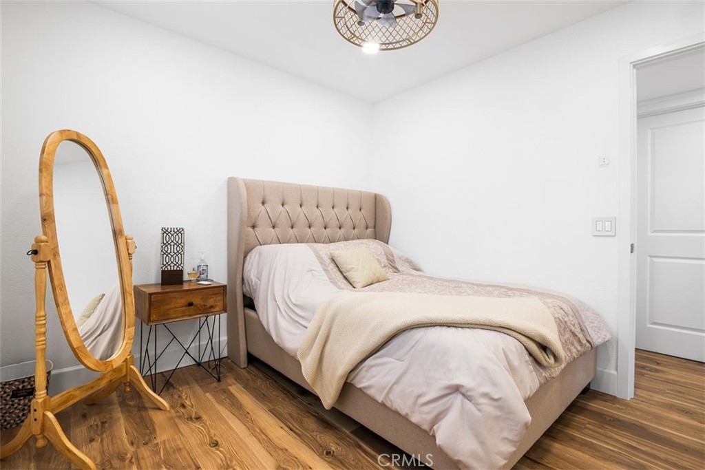 1216 Baseline Road La Verne, CA 91750 - Photo 25 of 37 a bedroom with a bed and a flat screen tv
