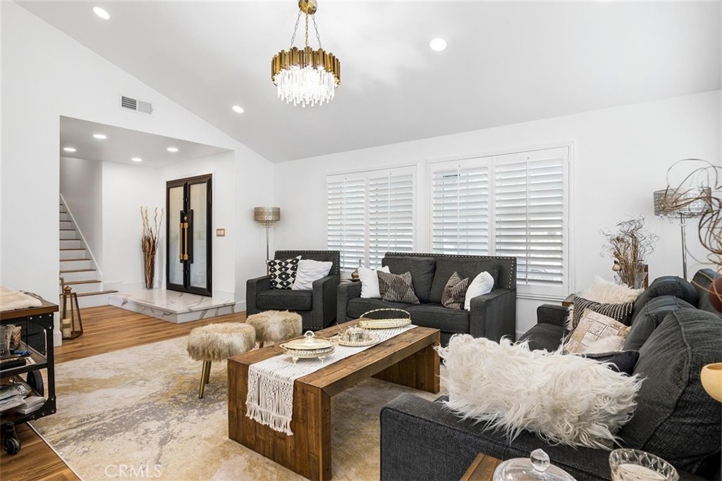 1216 Baseline Road La Verne, CA 91750 - Photo 8 of 37 a living room with furniture and a chandelier
