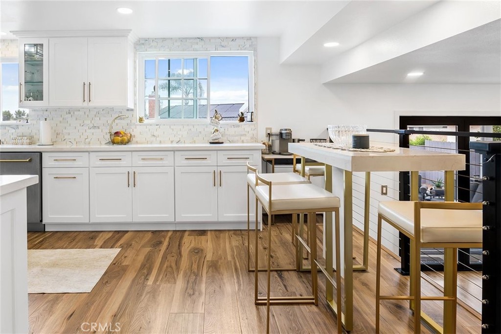 1216 Baseline Road La Verne, CA 91750 - Photo 9 of 37 a large white kitchen with cabinets