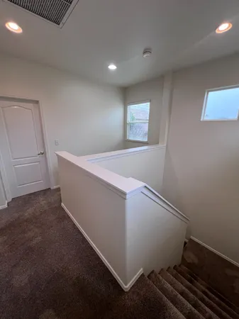 a view of a hallway with entryway