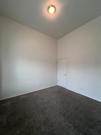 an empty room with a empty space and a window