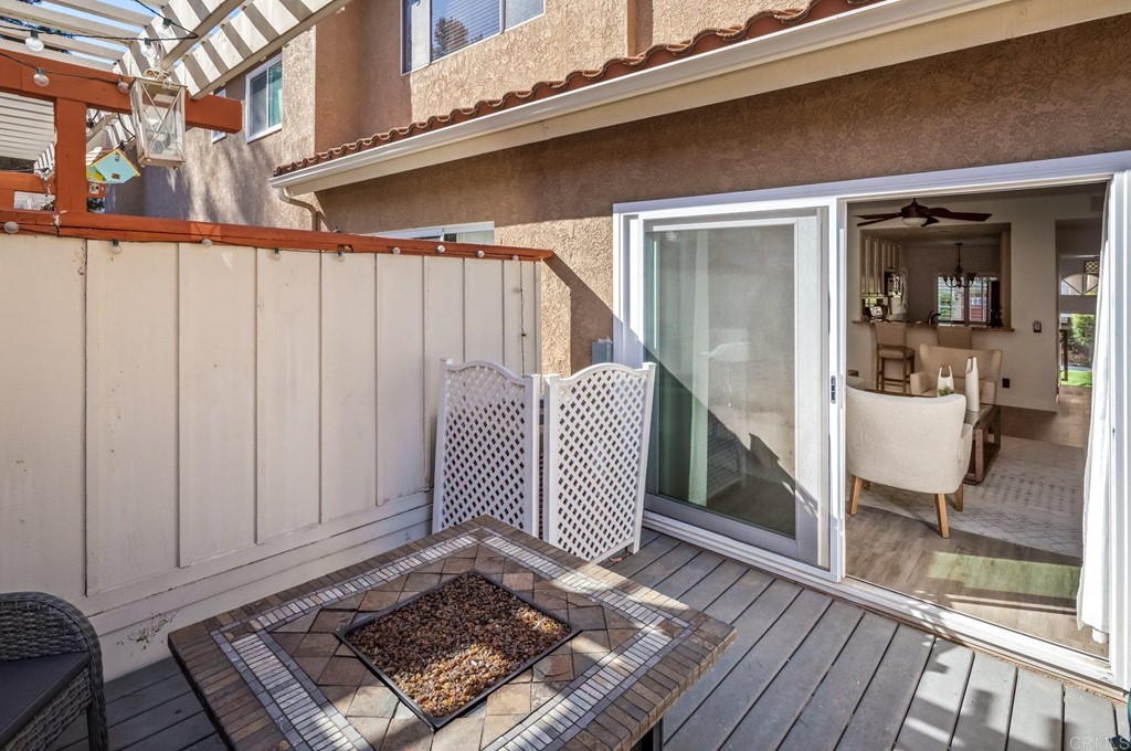 7777 Caminito Monarca, Unit 105 Carlsbad, CA 92009 - Photo 22 of 25 a view of a two chairs in the balcony