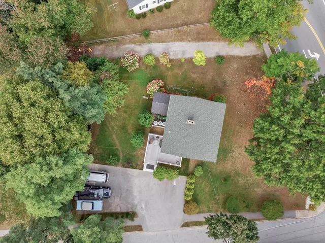 an aerial view of a house with outdoor space and street view