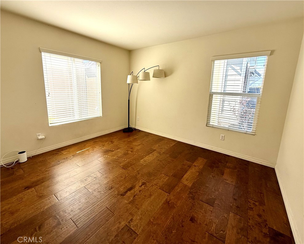 14540 Manchester Avenue Chino, CA 91710 - Photo 17 of 22 an empty room with wooden floor and windows