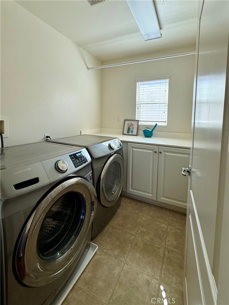 14540 Manchester Avenue Chino, CA 91710 - Photo 20 of 22 a utility room with sink dryer and washer