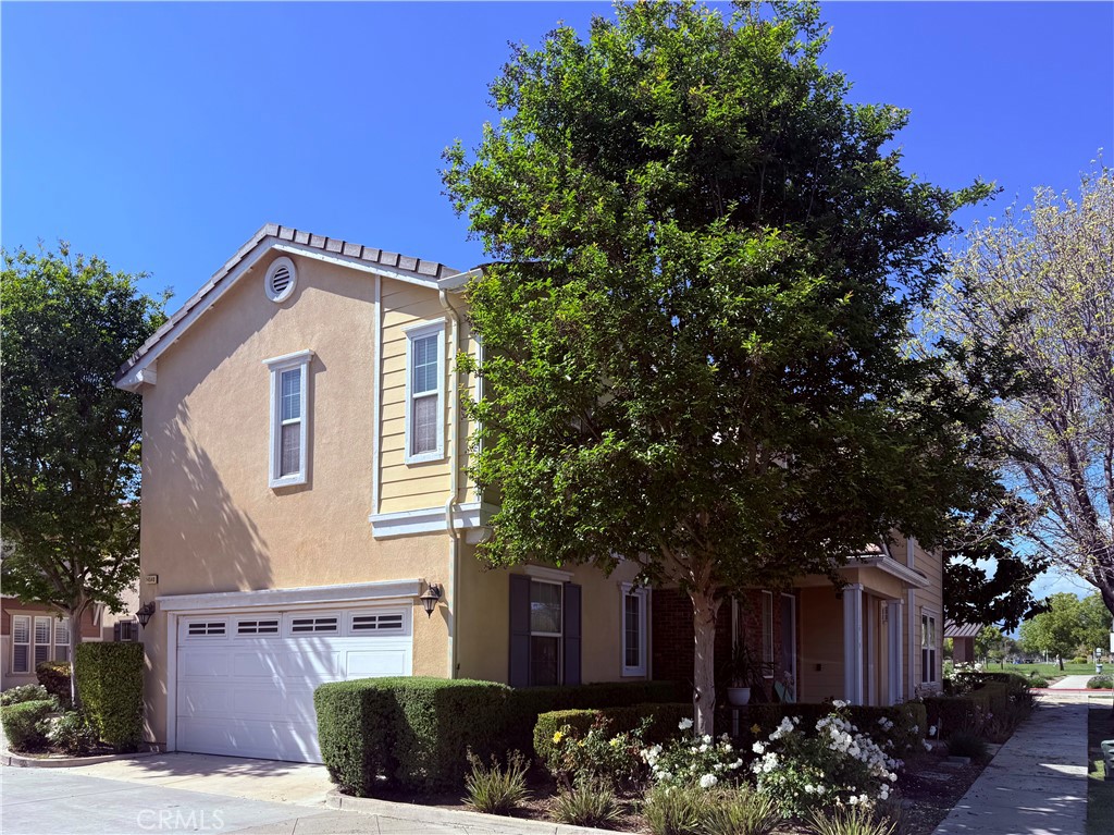 14540 Manchester Avenue Chino, CA 91710 - Photo 3 of 22 a front view of a house with a yard