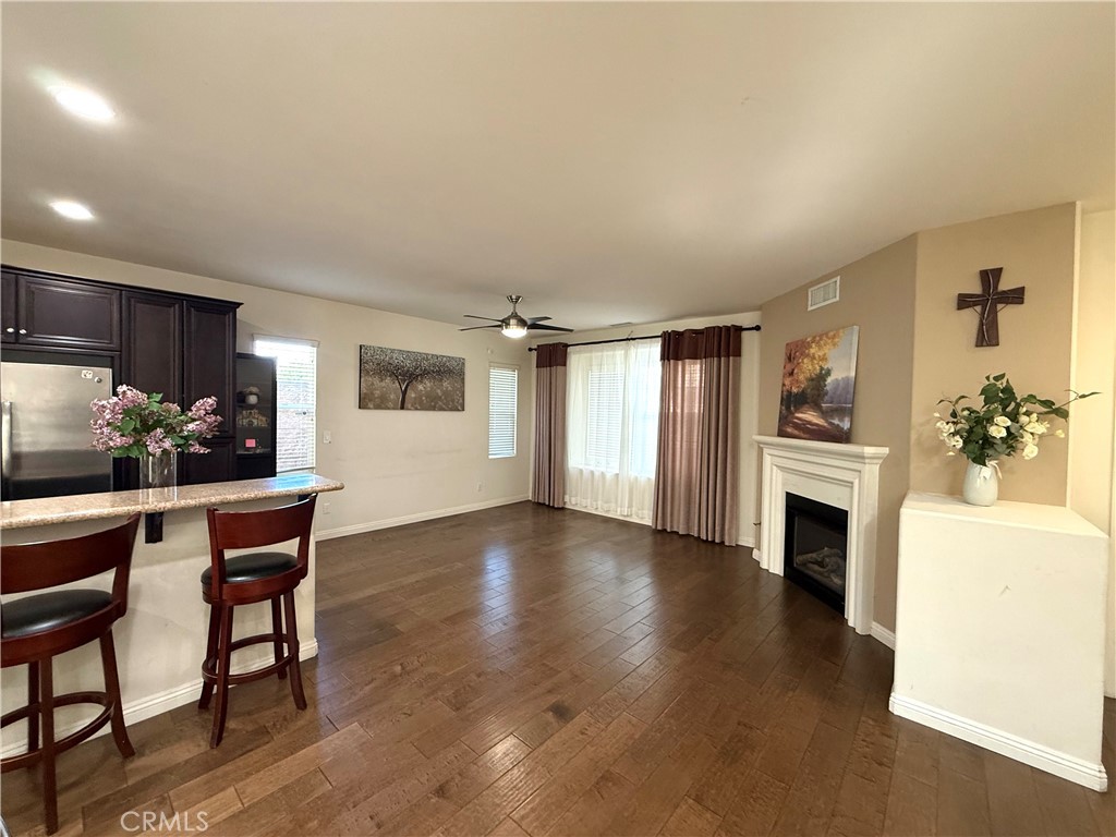 14540 Manchester Avenue Chino, CA 91710 - Photo 7 of 22 a view of a livingroom with furniture fireplace and wooden floor