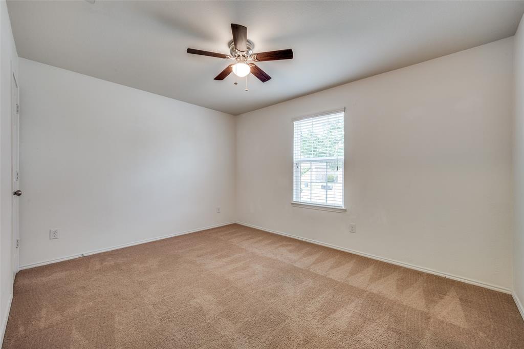 1420 Rivers Creek Lane Little Elm, TX 75068 - Photo 12 of 25 an empty room with a window and a fan