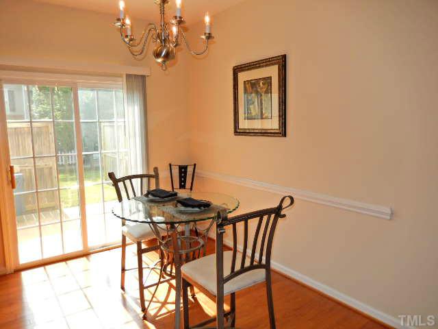 2131 Piney Brook Road, Unit 106 Raleigh, NC 27614 - Photo 3 of 23 a view of a dining room with furniture and a window