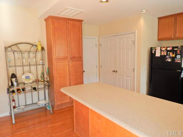2131 Piney Brook Road, Unit 106 Raleigh, NC 27614 - Photo 7 of 23 a bedroom with a bed and a table in it
